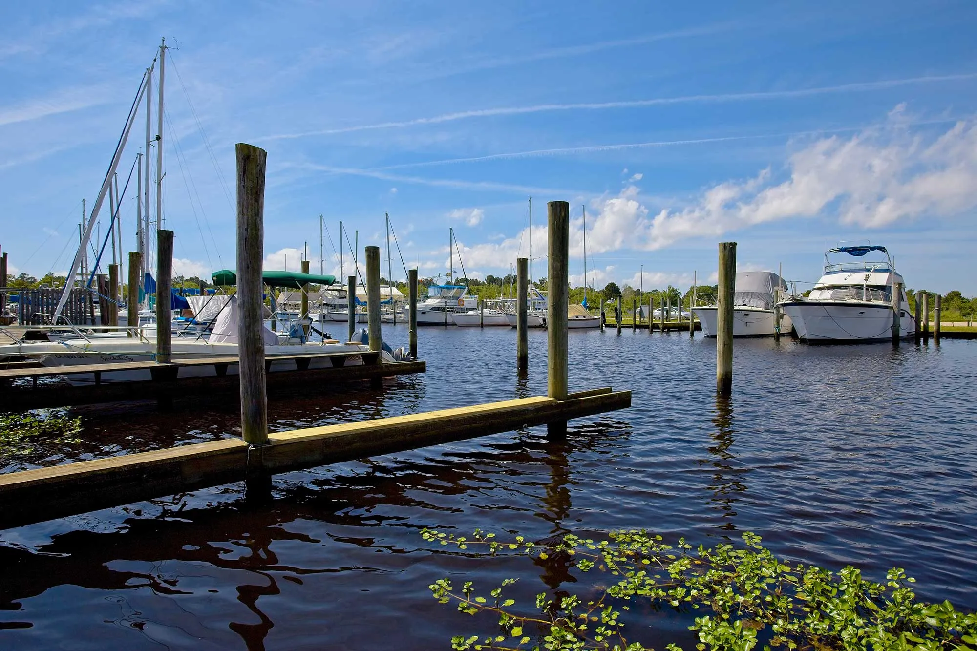 Boats Moored in a Marina in Bayou Libery in Slidell, Louisiana on a Sunny Spring Day